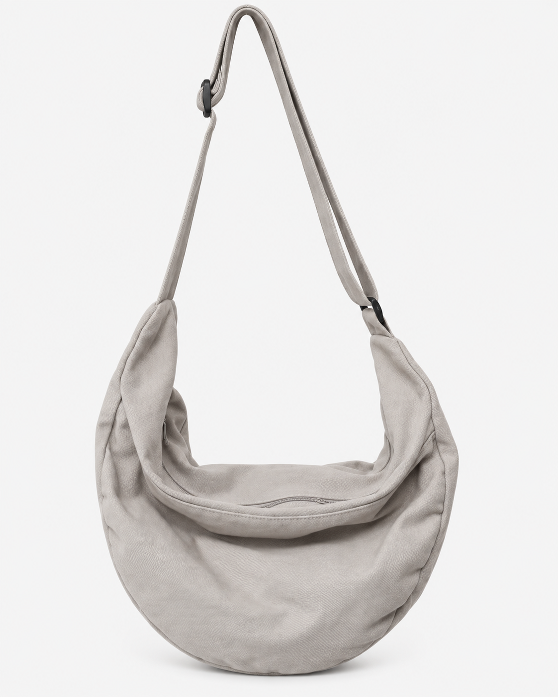 Light gray hobo shoulder bag with an adjustable strap and curved zip opening on a white background