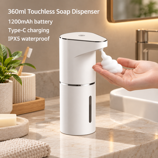 White automatic foam soap dispenser releasing foam into an open hand beside a bathroom sink