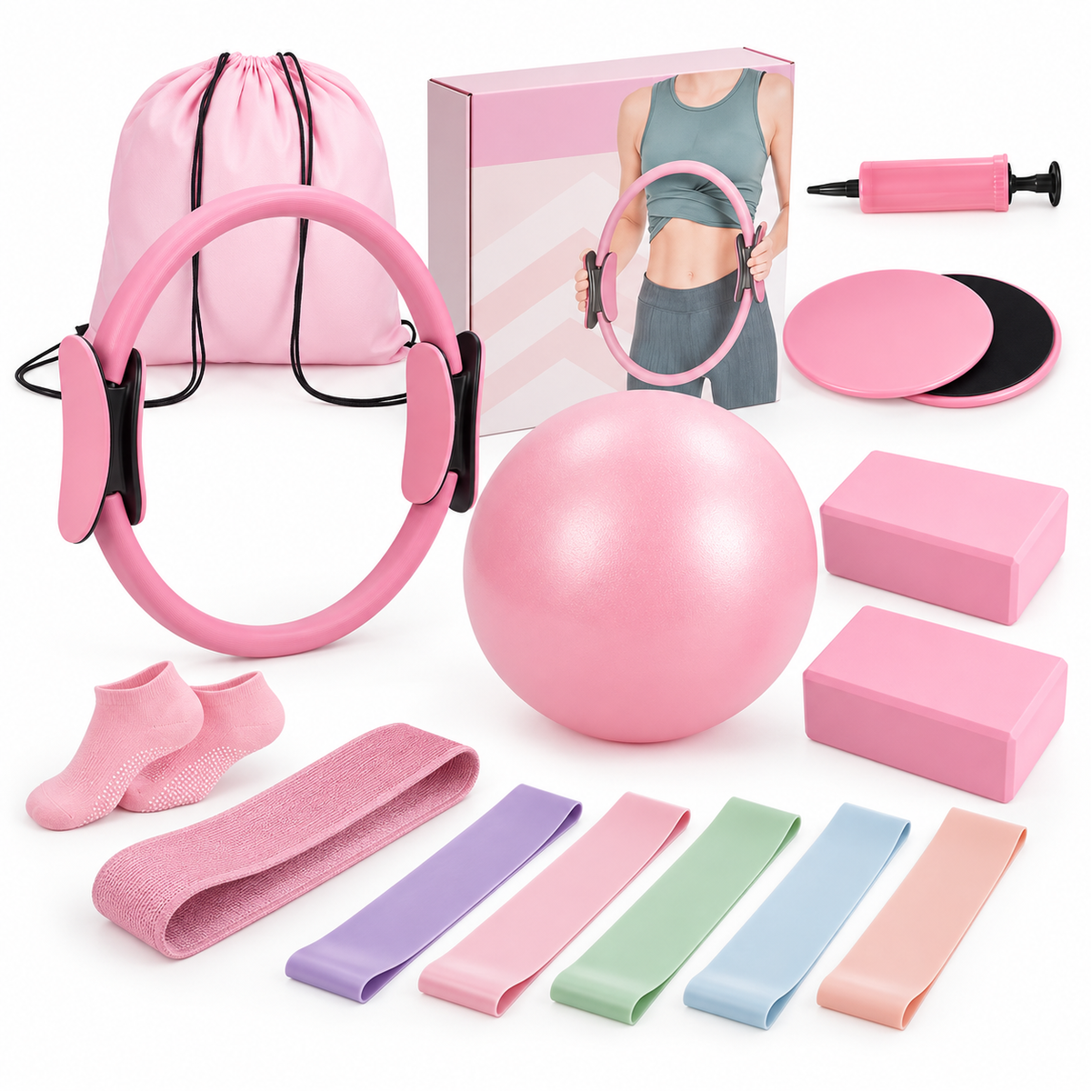 Pink Pilates kit with ring, ball, resistance bands, yoga blocks, gliding discs, grip socks, pump and storage bag beside packaging