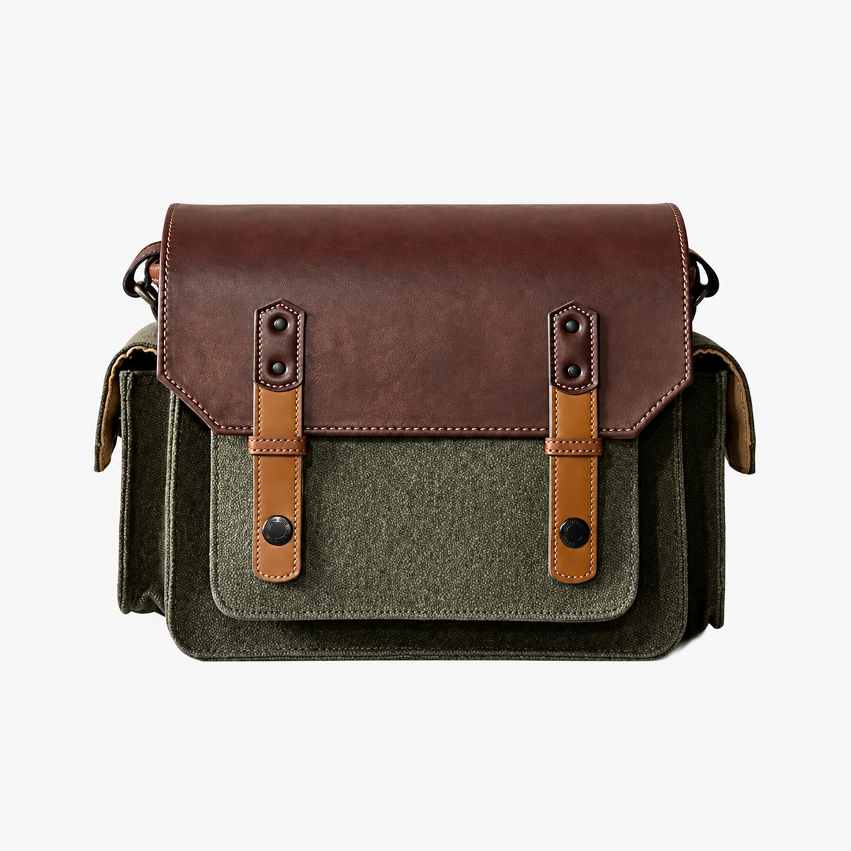 Front view of an olive green camera bag with a brown flap, tan fastening straps and side pockets on a white background