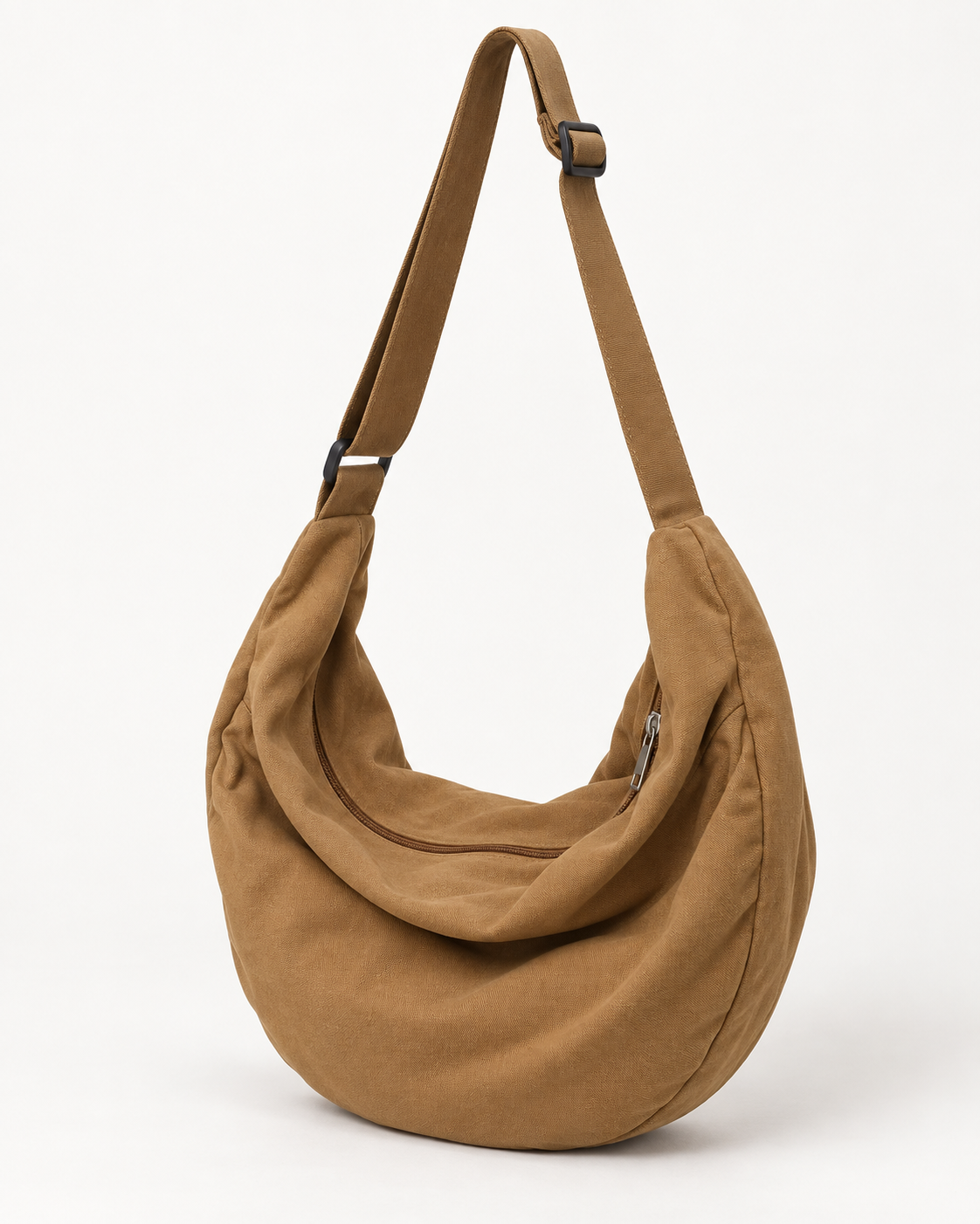Brown hobo shoulder bag with an adjustable strap and curved zip opening on a white background