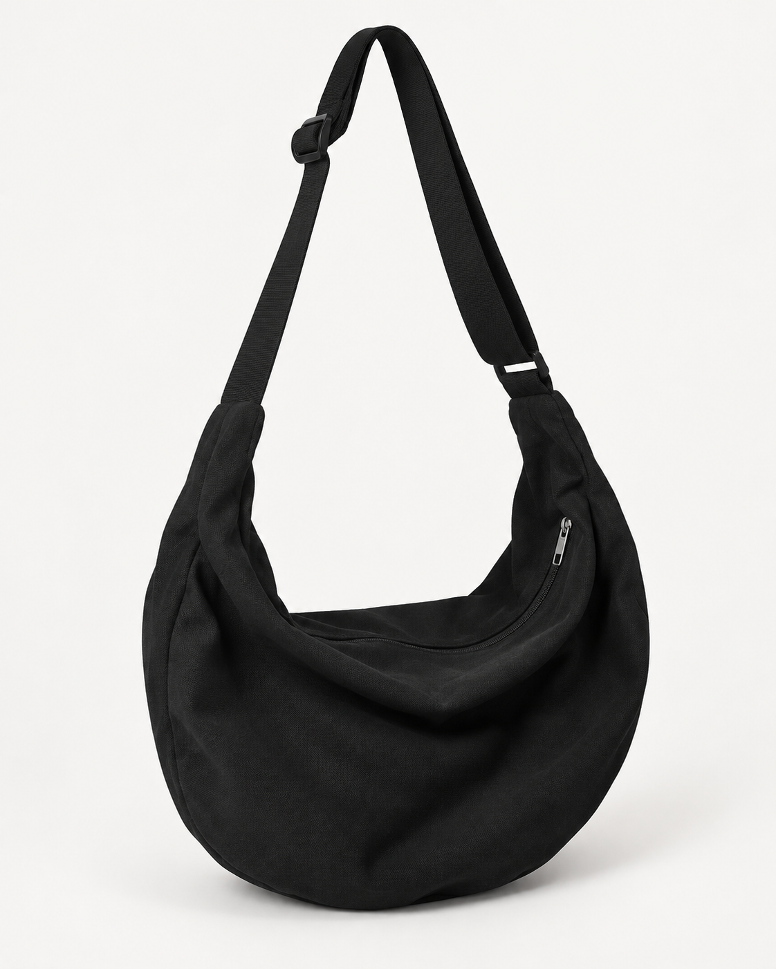 Black hobo shoulder bag with an adjustable strap and zip closure on a white background